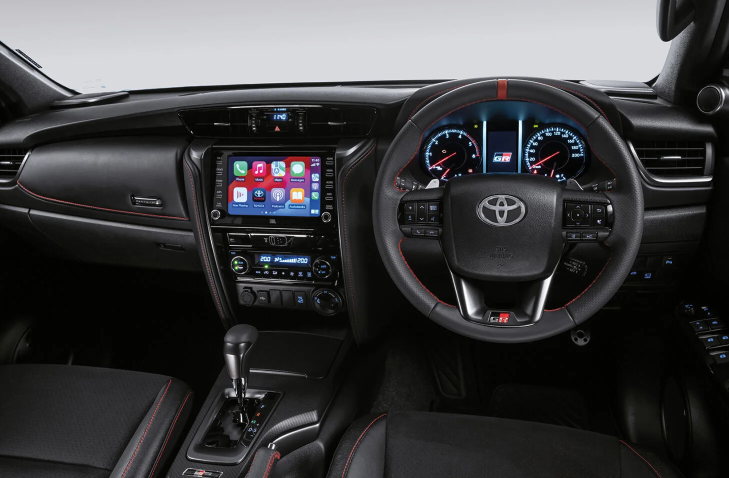 The cabin of a Toyota Fortuner, showing the dashboard, touchscreen and right-hand-drive steering wheel