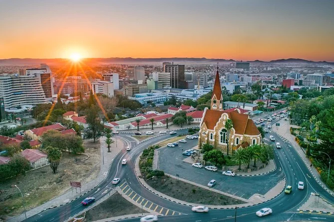 Aerial view of Windhoek at sunset, with the Christuskirche and the city spread out behind it